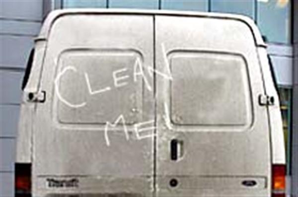 White van with 'clean me' written in dirt on the back door